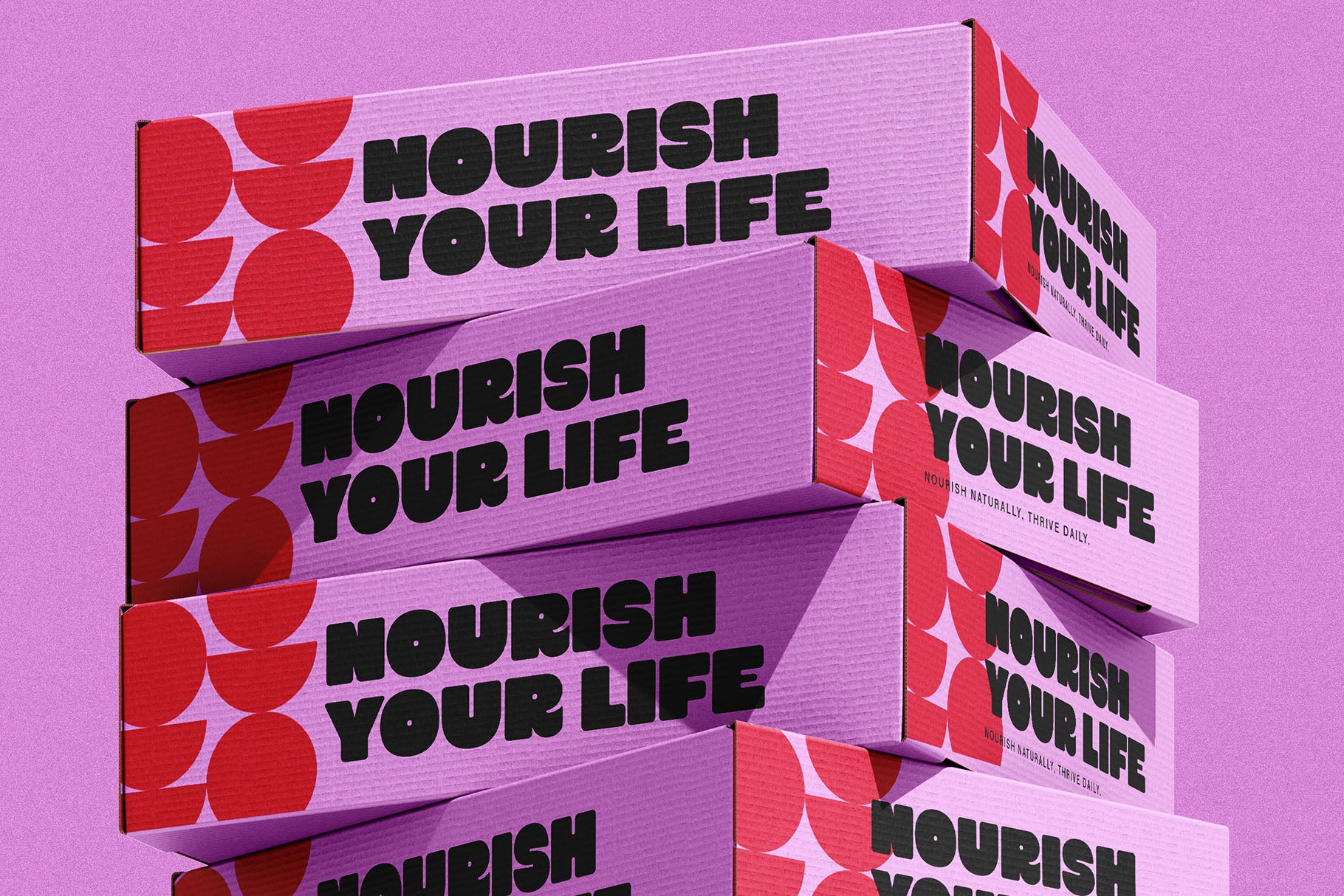 SLTF Curo heavy display sans serif - Nourish Your Life lettering on stacked pink boxes