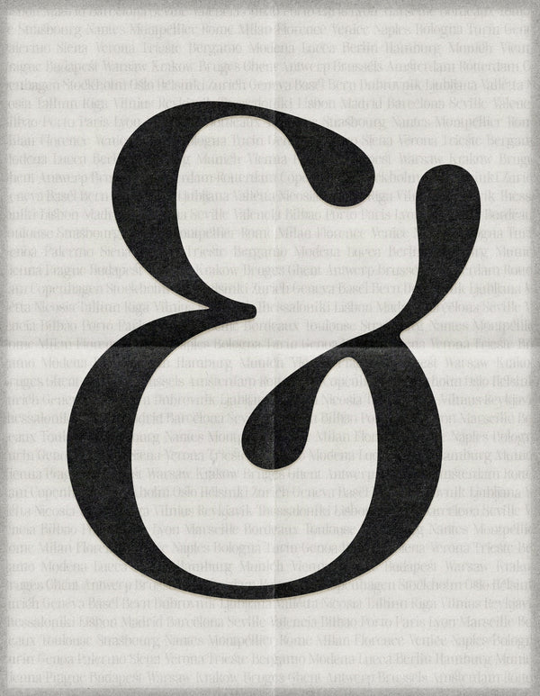 Large black SLTF The Brachen calligraphic ampersand printed on a folded newsprint textured paper