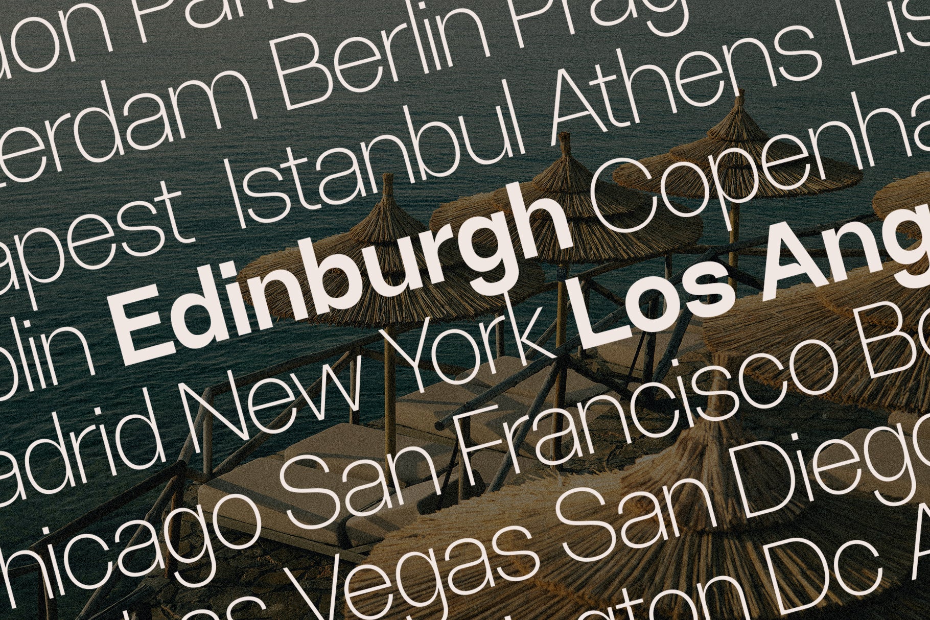 SLTF Ryecroft specimen over an angled photograph of thatched beach umbrellas and loungers above dark sea water. City names are layered across the frame in a light cream weight - Amsterdam, Berlin, Prague, Budapest, Istanbul, Athens, Copenhagen, Madrid, New York, Chicago, San Francisco, Las Vegas and San Diego - with Edinburgh and Los Angeles set in bold to break up the field.