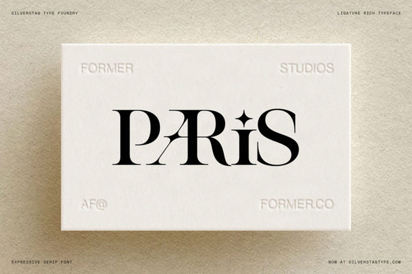 Paris wordmark in SLTF Spanish Archer on an embossed Former Studios business card