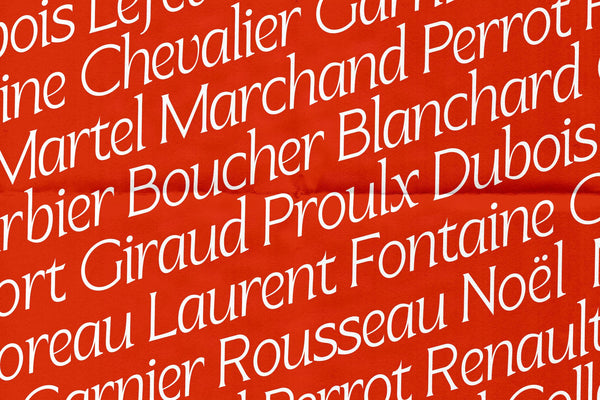 SLTF Arcilla Light Italic tiled across a bold red field — a repeating diagonal pattern of French surnames including Chevalier, Marchand, Blanchard, Rousseau, Fontaine, and Noël set in white. Demonstrates the typeface's 100+ language Latin Extended support and its elegance in fashion-forward typographic patterns.