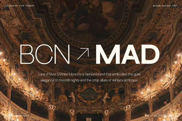 SLTF Ryecroft branding mockup over a photograph of an ornate gilded theatre interior with painted ceiling and tiered balconies. BCN and MAD are set large in white, the first in a thin weight and the second in a heavy weight, separated by a diagonal arrow. A short paragraph below introduces Lune d'Hiver, a fashion brand, set in the light weight across two centred lines.