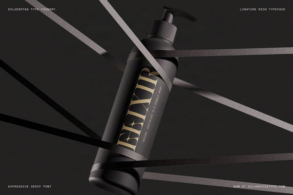 Elixir wordmark in SLTF Spanish Archer on a black pump bottle wrapped in ribbons